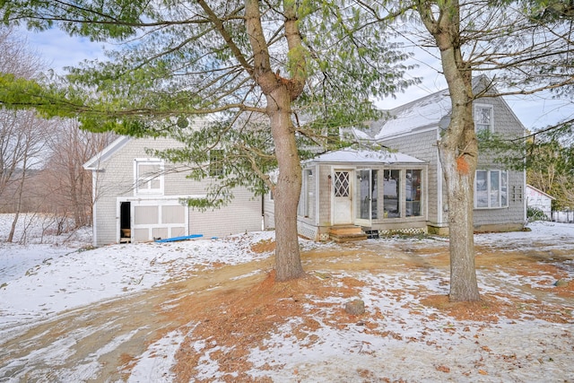 exterior space featuring a sunroom