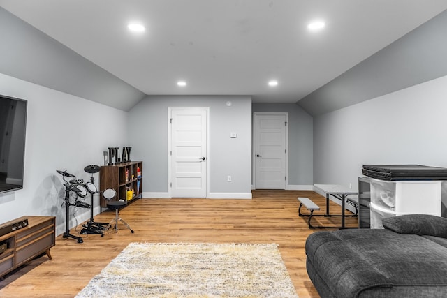 interior space featuring light hardwood / wood-style flooring and vaulted ceiling