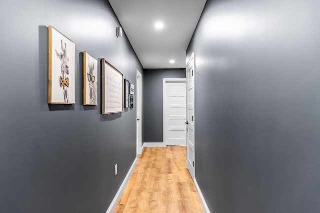 corridor featuring light hardwood / wood-style floors