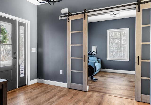 entrance foyer featuring hardwood / wood-style flooring and a barn door