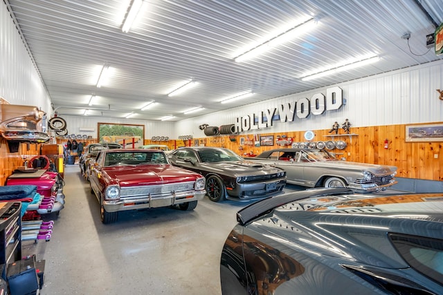 garage featuring wood walls