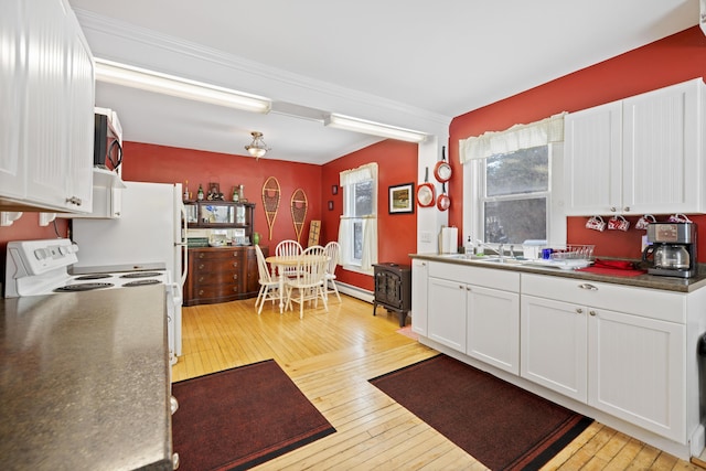 kitchen featuring white cabinetry, sink, a baseboard heating unit, light hardwood / wood-style floors, and electric stove