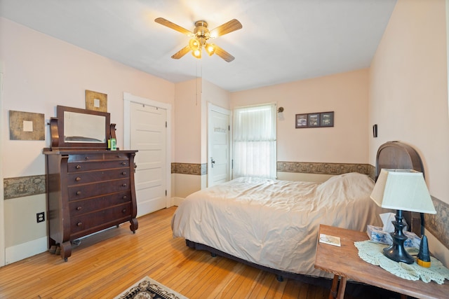 bedroom featuring ceiling fan and light hardwood / wood-style floors