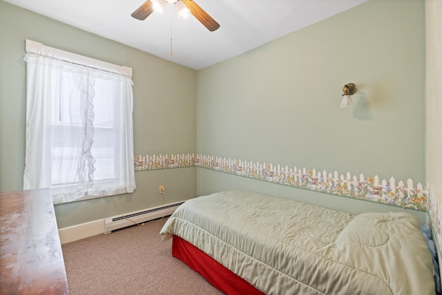 bedroom with a baseboard radiator, carpet, and ceiling fan