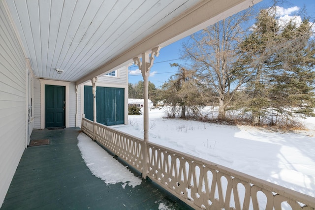 view of snow covered deck