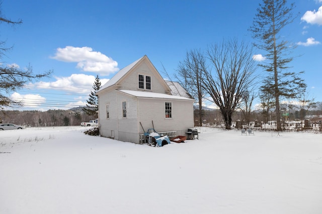 view of snow covered house