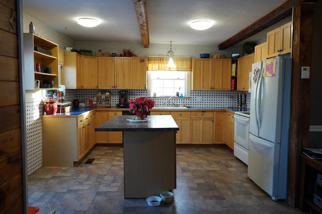 kitchen featuring sink, white appliances, light brown cabinets, and a center island