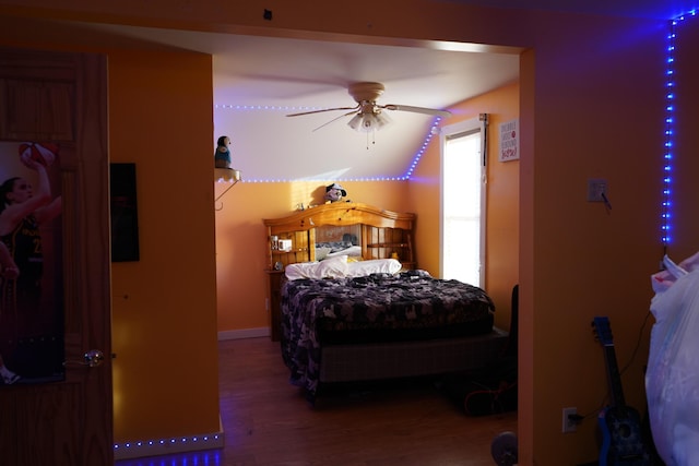 bedroom featuring ceiling fan and hardwood / wood-style flooring