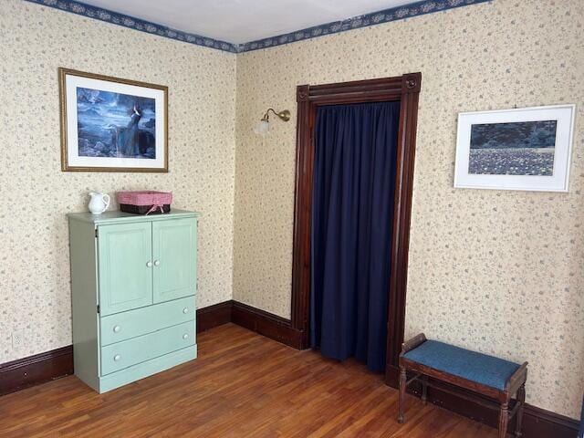 unfurnished bedroom featuring dark hardwood / wood-style flooring