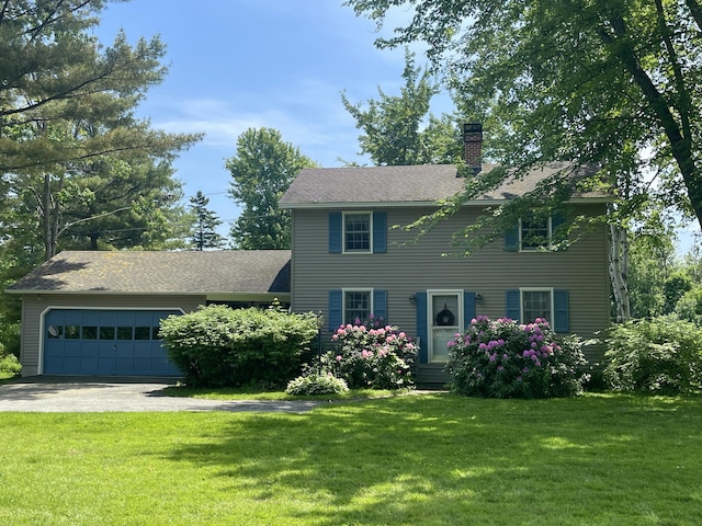 view of front facade featuring a garage and a front yard