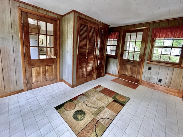 entryway with wooden walls