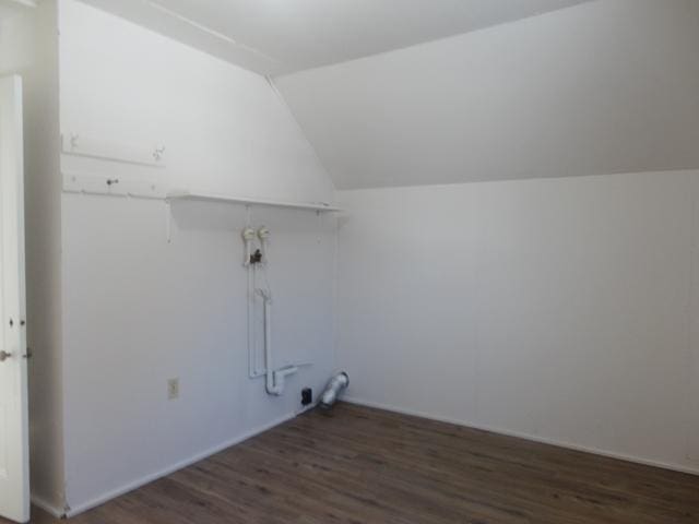 clothes washing area featuring dark hardwood / wood-style flooring