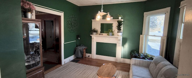 interior space with crown molding, hardwood / wood-style floors, and a chandelier