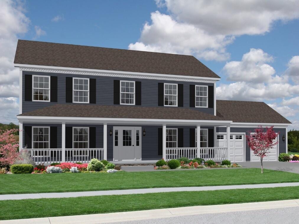 colonial home with a garage, a front lawn, and covered porch