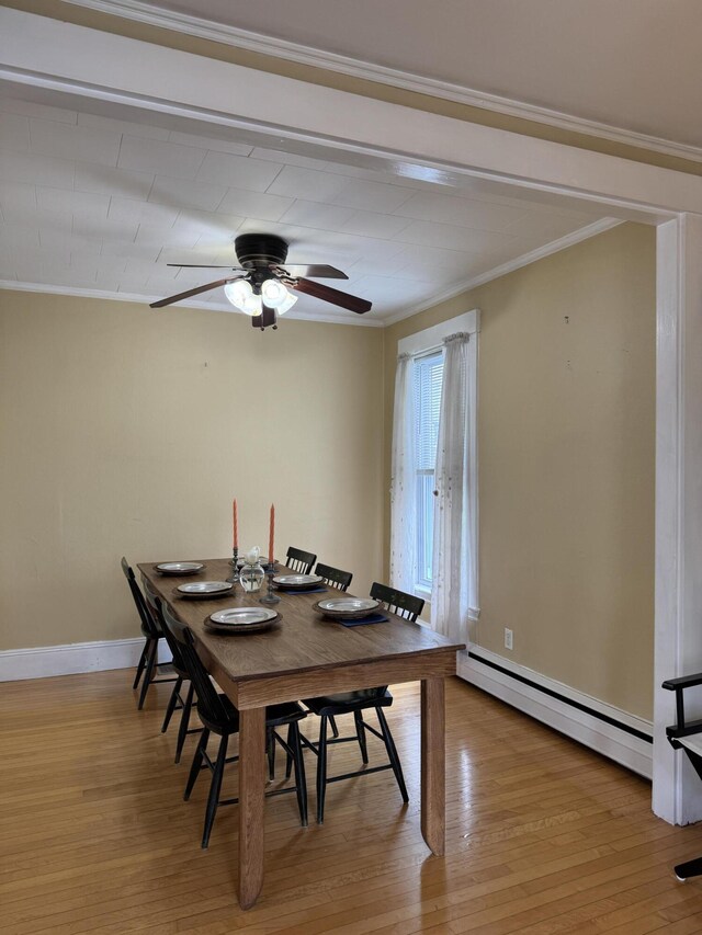 120 Birch St, Bangor, ME 04401 - dining space with baseboard heating, ornamental molding, baseboards, light wood-style floors, and a ceiling fan