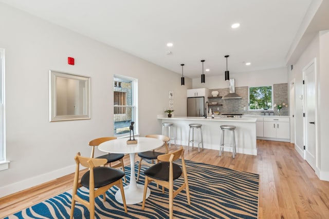 dining room with light hardwood / wood-style flooring