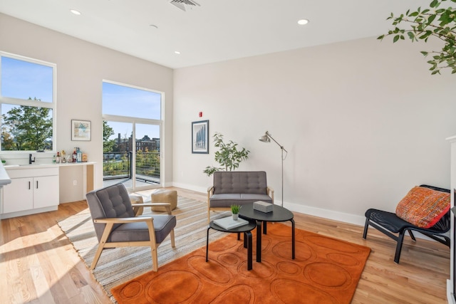 sitting room featuring light wood-type flooring