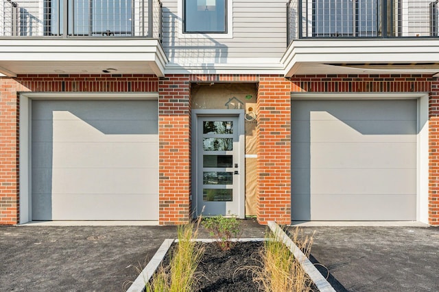 entrance to property featuring a garage