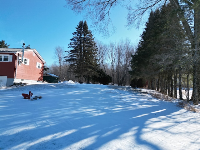 view of yard layered in snow