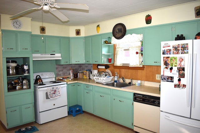 kitchen featuring sink, white appliances, green cabinetry, ceiling fan, and backsplash