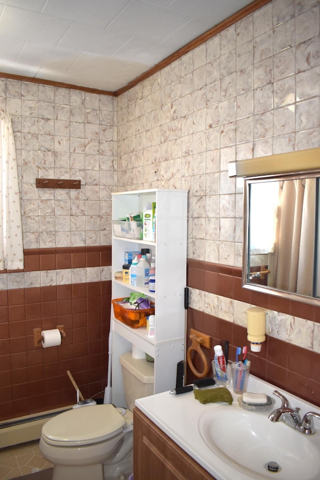 bathroom with vanity, tile walls, tile patterned floors, and toilet