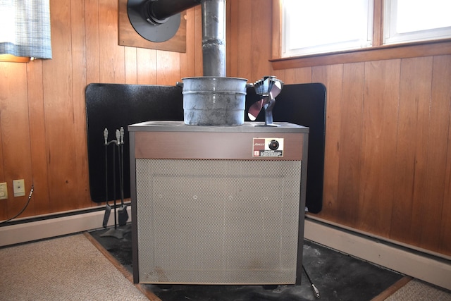 details with a baseboard heating unit and wooden walls