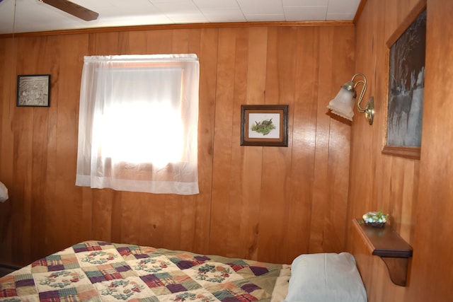 bedroom with wooden walls