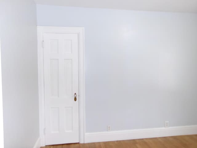 empty room featuring hardwood / wood-style flooring