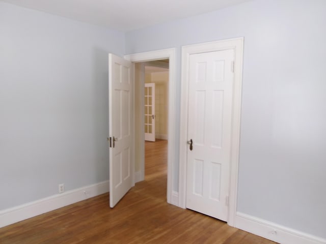 empty room featuring hardwood / wood-style flooring