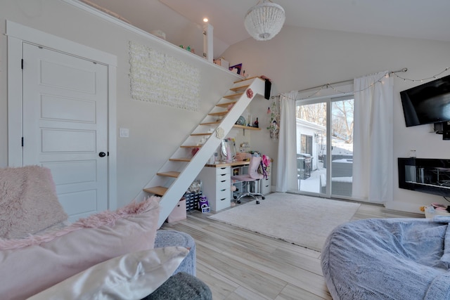 living room with lofted ceiling and light hardwood / wood-style floors