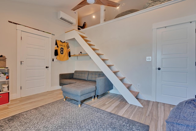 interior space with hardwood / wood-style floors and an AC wall unit