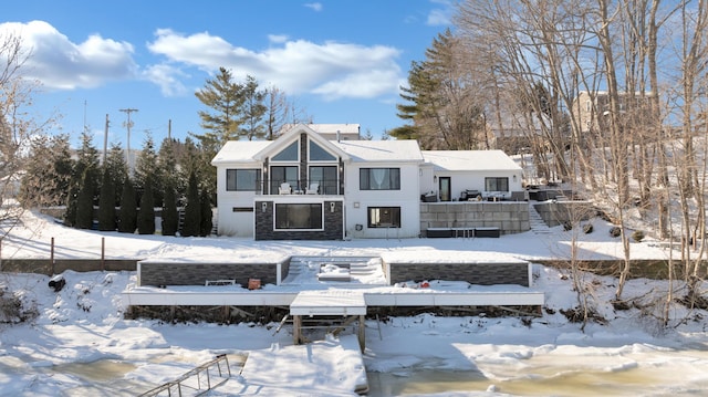 view of snow covered house
