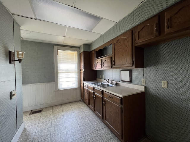 kitchen with sink and dark brown cabinets