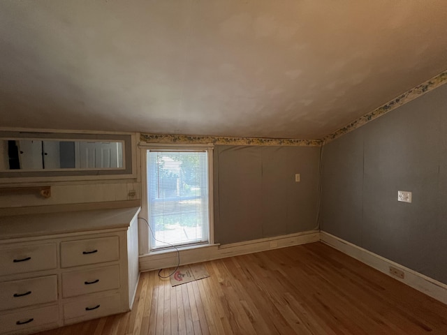 additional living space with light wood-type flooring