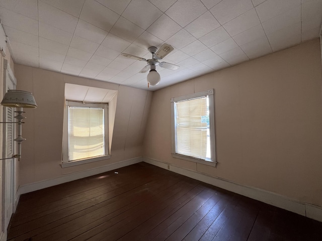 unfurnished room with ceiling fan and dark hardwood / wood-style floors