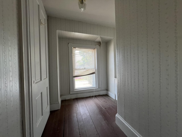 corridor with dark wood-type flooring