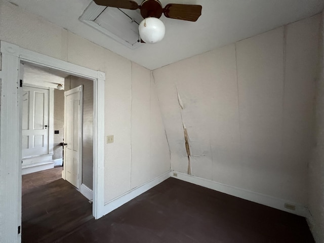 empty room featuring dark hardwood / wood-style floors and ceiling fan