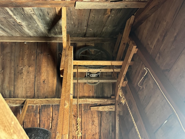 room details featuring wooden walls and wood ceiling