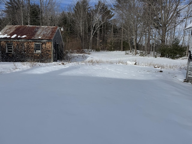 view of yard covered in snow