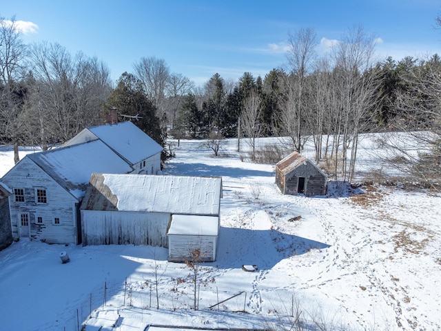 snowy yard with an outdoor structure