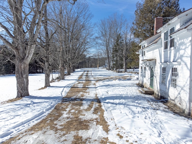 view of yard layered in snow