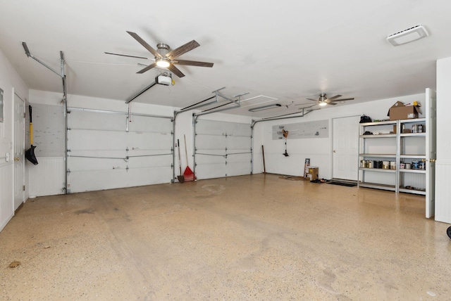 garage with a garage door opener and ceiling fan