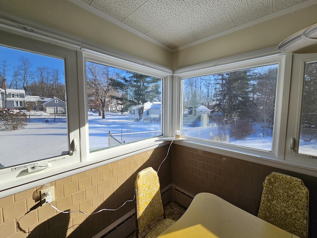 sunroom with a baseboard radiator