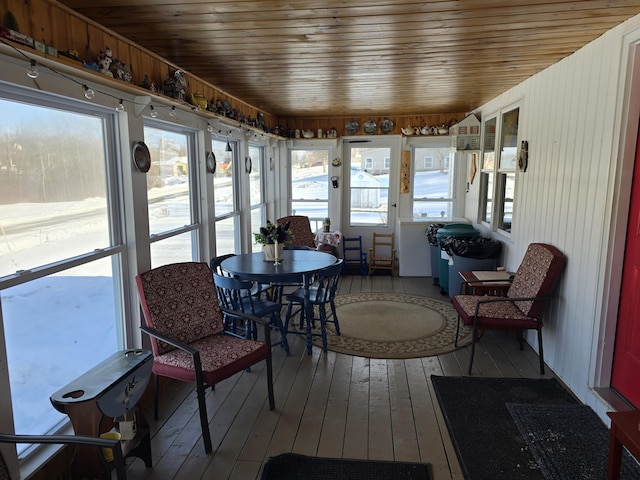 sunroom / solarium featuring wood ceiling