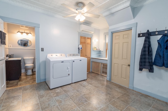 laundry area with ceiling fan, a wall mounted AC, and washer and clothes dryer