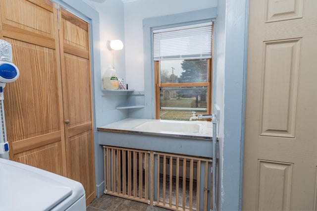 bathroom featuring washer / clothes dryer and sink