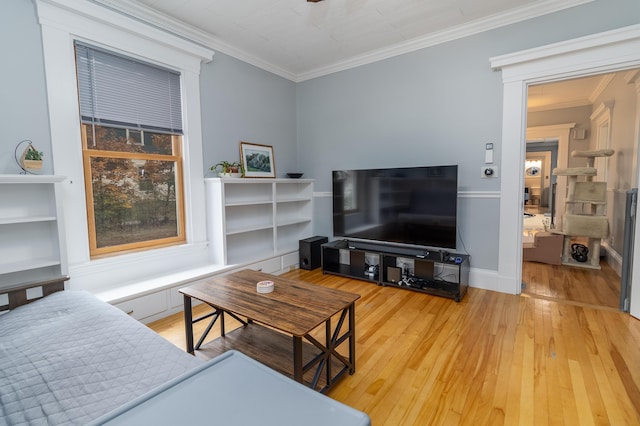 living room with ornamental molding and wood-type flooring