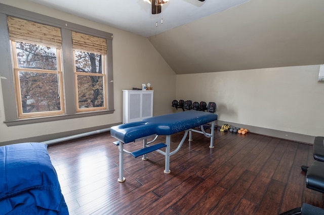 recreation room with ceiling fan, lofted ceiling, and dark hardwood / wood-style flooring