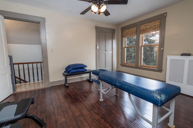 game room with radiator and hardwood / wood-style floors