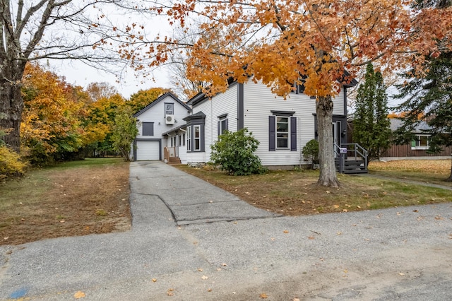 view of front facade featuring a garage and a front yard